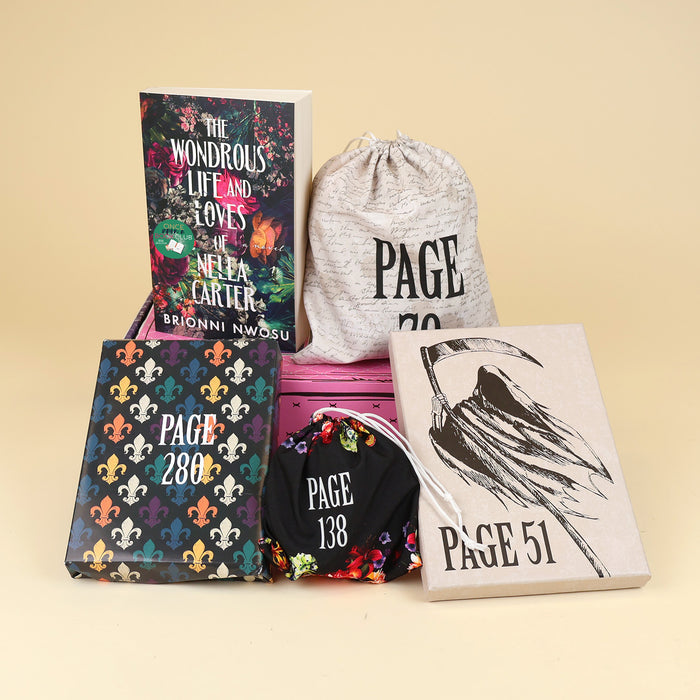 A paperback edition of The Wondrous Life and Loves of Nella Carter stands on a pink OUABC box next to a drawstring bag labeled with a page number. In front of the box are three wrapped gifts labeled with page numbers.