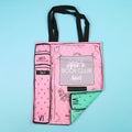 Pink tote bag with "Once Upon a Book Club Adult" design, featuring a book spine illustration motif.