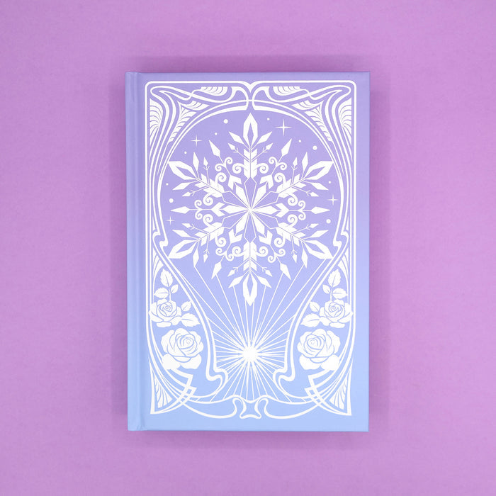 The hard case of 'The Sun and the Starmaker' by Rachel Griffin showcasing an intricate, winter design on a purple background.