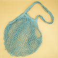 a teal woven produce bag